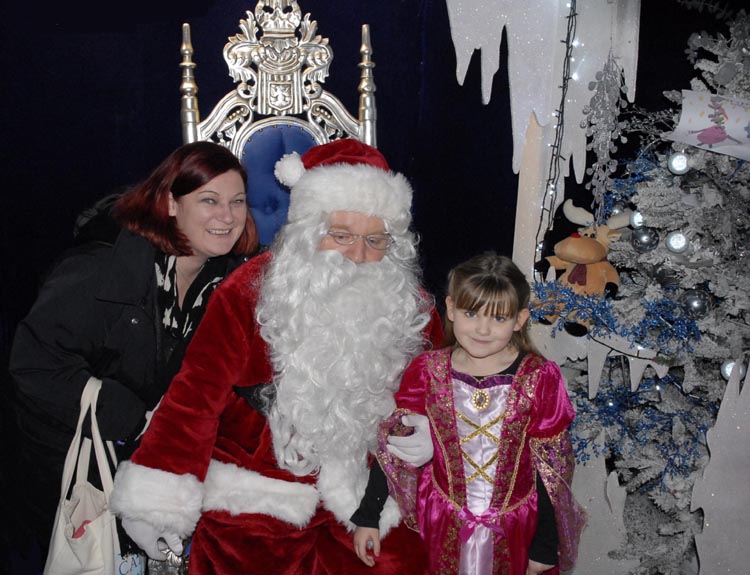 [Emma and Mummy meet Santa]
