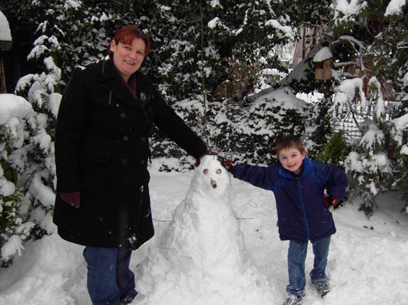 [Marnie and Tom build a snowman]